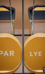 the pair of chairs are on display with the logo