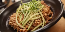 a close up of food in a bowl on a table