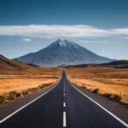 the road is empty by the large mountain