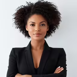 a beautiful black woman with an afro in a black suit