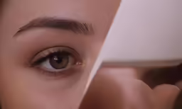 a woman that is looking into the mirror