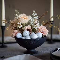 a bowl of eggs are shown with flowers and candles