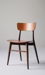 an old chair with a wooden seat