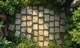 view from above, looking down at a concrete stepping area in the grass