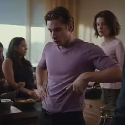 a man and two women are looking at food