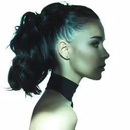 a woman wearing a black collared top with high bun