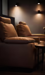 a couch and chair in a room that is lit up