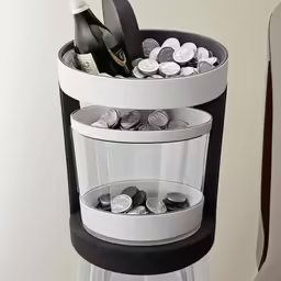 wine and confection in the bottom shelf of this stand