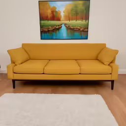 the couch is near a large art piece