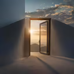 an open door in the wall reveals sunset over mountains