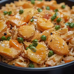 a close up of a plate of food with onions and vegetables