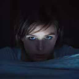 a woman that is in some kind of dark room