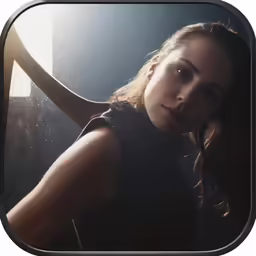 the woman has her arm up near her face