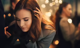 the woman is putting on her hair