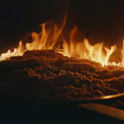 a fire is being lit inside of a bowl