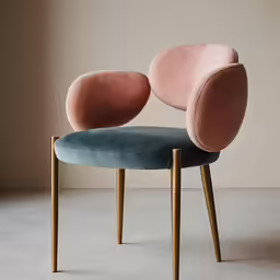 a pink chair sits on the concrete floor