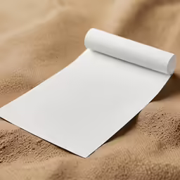 a roll of paper that is sitting on top of a bed