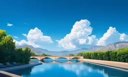 a pool sits beneath a blue sky, with a stone bridge above it