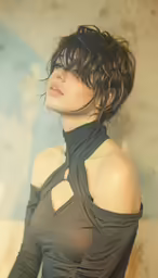 a woman with wet hair is wearing a black shirt
