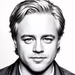 black and white photo of a man in a jacket