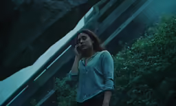 a woman holding a cell phone up to her ear