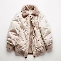 an empty jacket laying on top of a table
