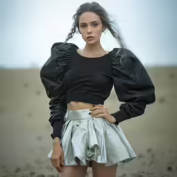 the girl is wearing black and white clothes and a black top