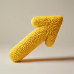 a yellow toy with a pointed down one side