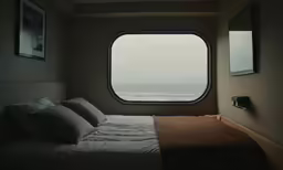 there is a bed and a big window
