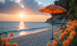 an orange umbrella on the beach near the water