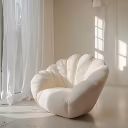 an oval chair in the center of a room with white curtains