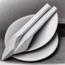 a white plate topped with two pieces of paper