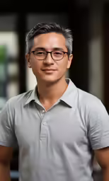 a man is standing in the street smiling