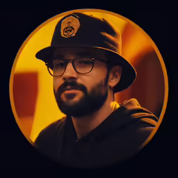a man wearing glasses, a hat and an orange circle