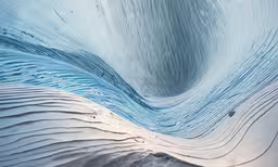 a large blue wave is seen from above,a view inside of the inside of a snow sculpture