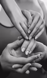 two women holding hands on the other hand