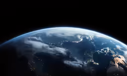 the earth seen from space, showing cities at night