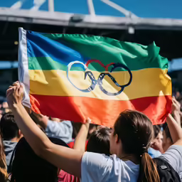 a group of people holding a flag in the air