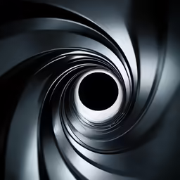 the top part of an industrial structure showing a black hole in the metal