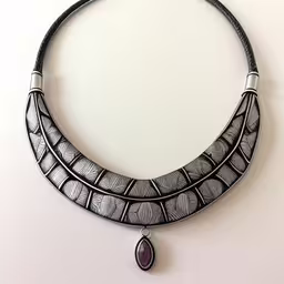 a necklace with a purple stone and white beads,an artisticly designed necklace with a unique design on it,a collar necklace with pendants and stone inlaid,this is a picture of a necklace that looks like a choker,an unusual necklace that has a black and white pattern, and a tear shaped drop hangs on the side of it