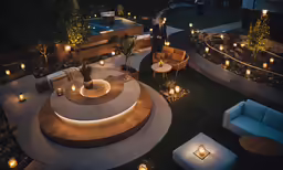 a lit patio and seating area with lights all around