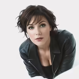 a woman posing with a black leather jacket