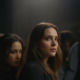 people in the back, with the woman staring on
