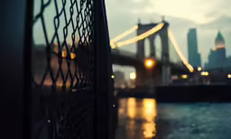 a close up photo of some water and a bridge
