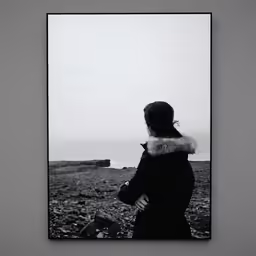 a woman looking out into the distance in an empty space