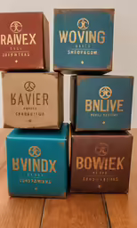 six boxes of barber soap sitting on a table