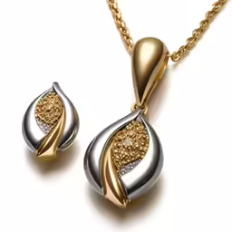 a necklace and earrings set made with yellow gold, silver and white diamonds