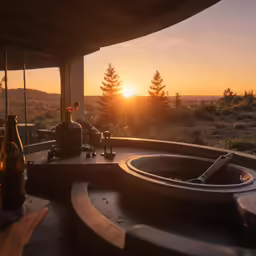 an outdoor area with some bottle on the table