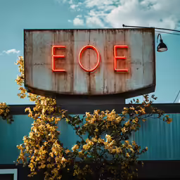 an old sign on the side of a building