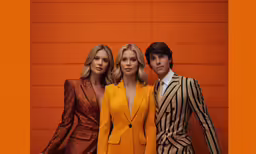three people are standing next to each other